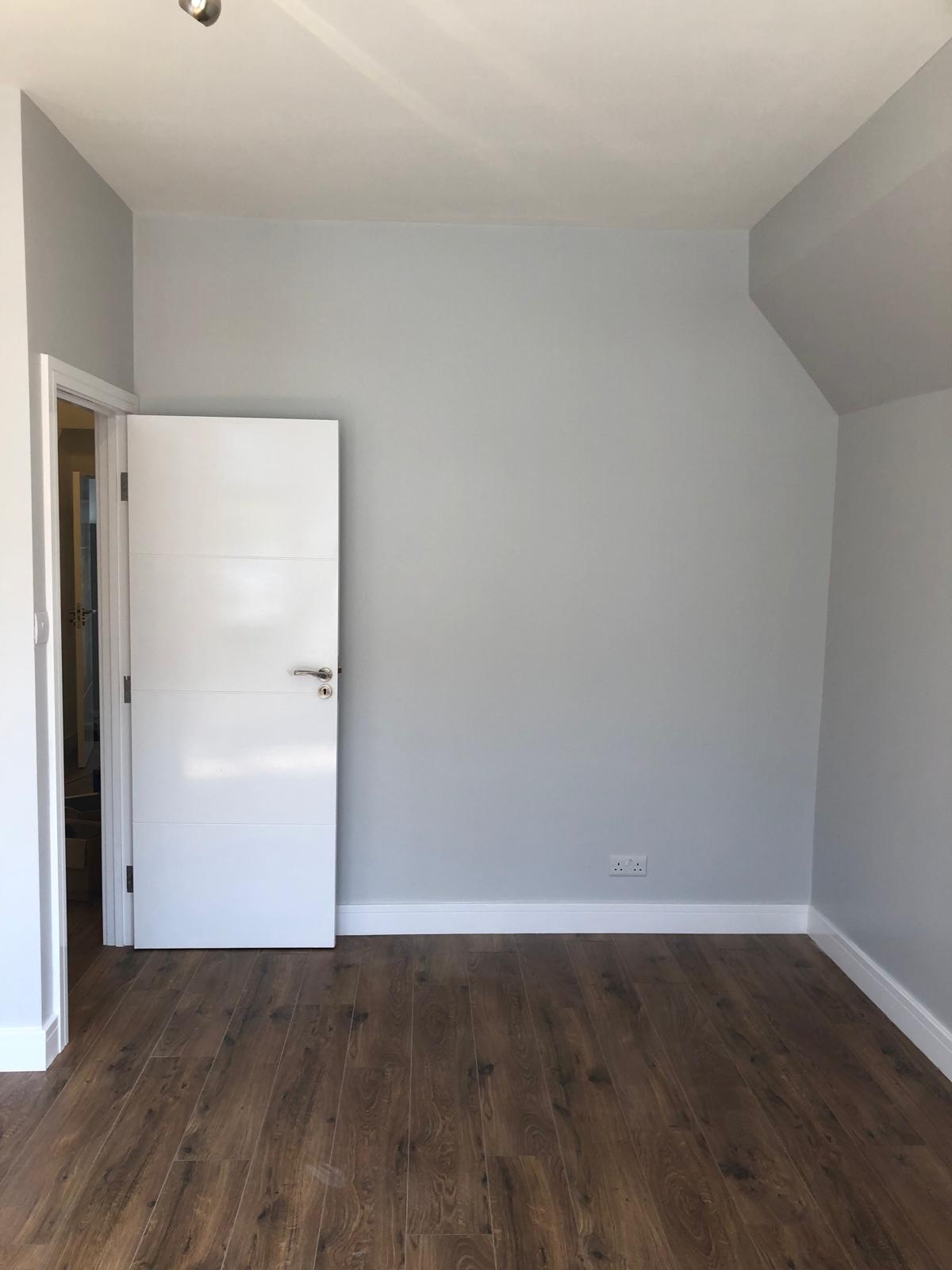 Bedroom remodeling with new flooring and custom dors