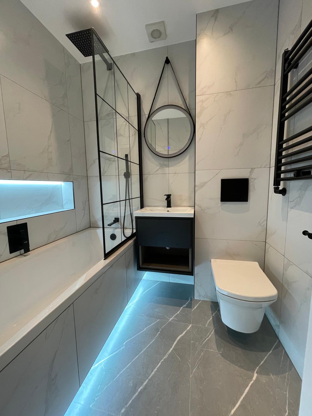 Bathroom renovation featuring new tiles and contemporary fixtures