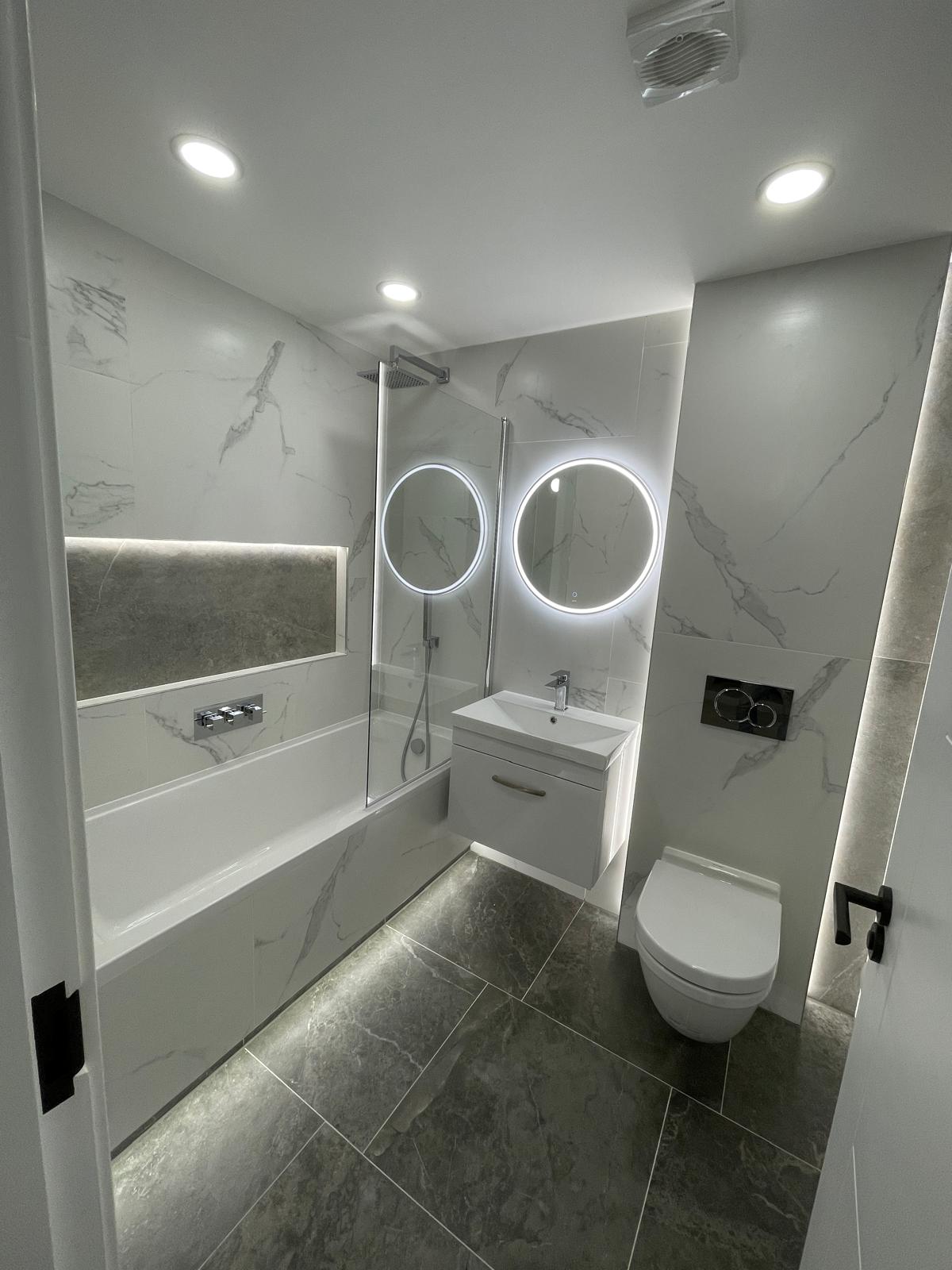 Bathroom renovation featuring new tiles and contemporary fixtures